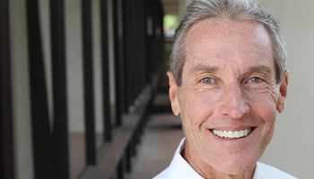 Man smiling at an office