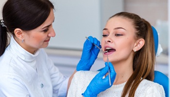 Female dental patient having her teeth cleaned