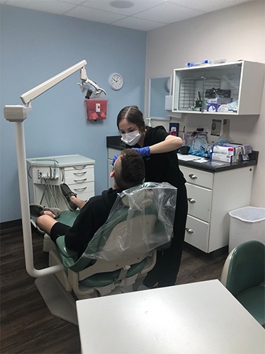 dental staff working on patient