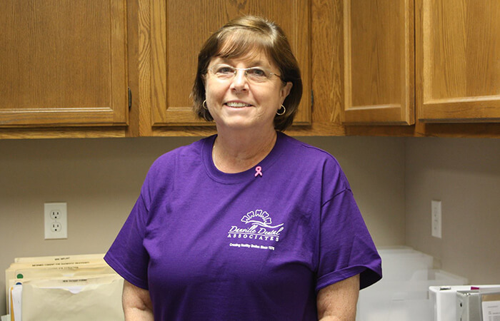 Dental assistant smiling in the lab