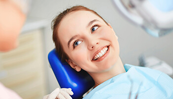 Young woman smiling in dental chair