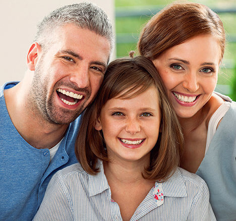 Smiling mother father and teenage girl