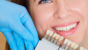 Woman getting professional teeth whitening in Danville from her dentist