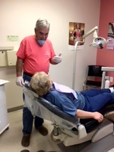 Dr. Albert Payne speaking with a patient.