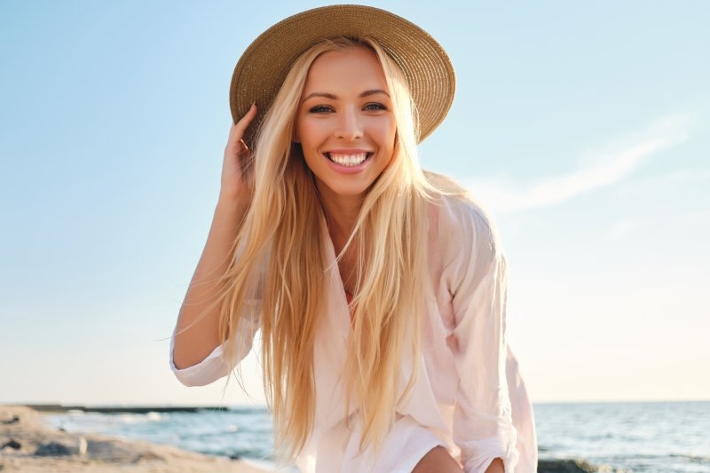 girl smiling at beach during summer vacation