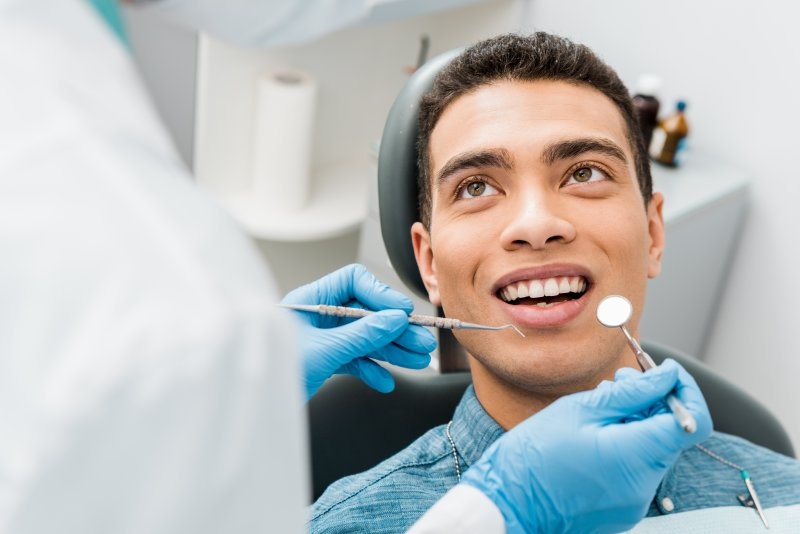 a man undergoing a dental checkup in Danville