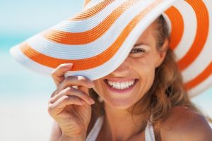 a woman with a beautiful smiles enjoying her summer vacation